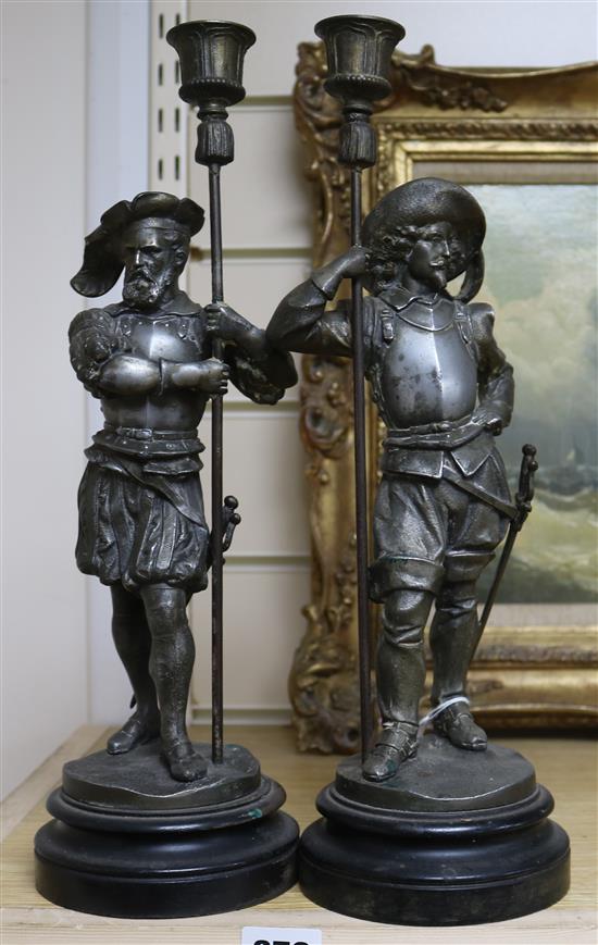 A pair of French spelter figural candlesticks